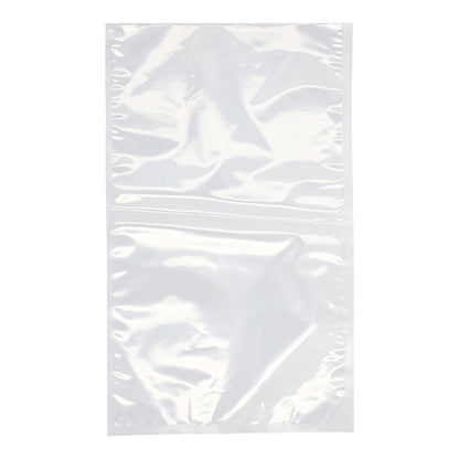 A PAPSTAR 100 edge-sealed bag, PA/PE transparent, from PAPSTAR GmbH, is presented flat and unsealed on a white background. The transparent plastic bag, ideal for food storage, shows slight creases and a central seam.