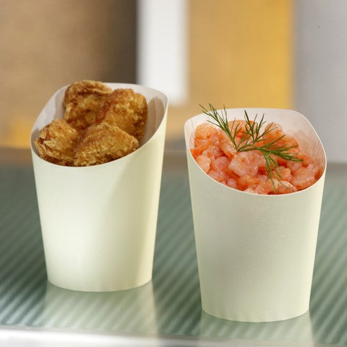 Two beige PAPSTAR snack cups To Go (Ø 7.5 cm, 0.16 l) from PAPSTAR GmbH stand next to each other; one contains fried snacks, the other shrimp with dill. The two eco-friendly cardboard cups are on a striped surface.
