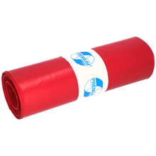 Ein eng gerolltes Bündel DEISS 11102 Müllsäcke 700x1100 mm Typ 100 rot (25 Stück) der EMIL DEISS KG, gesichert mit einem weißen Etikett mit blauer "PREMIUM"-Grafik auf hellem Grund - ideal für eine effiziente Abfallentsorgung.