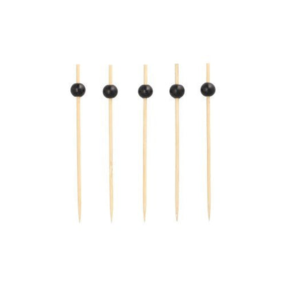 Five PAPSTAR 250 Finger Food - Pickers of the PAPSTAR GmbH: Eco-friendly wooden skewers with black beads at the top are arranged vertically in a row against a plain white background.