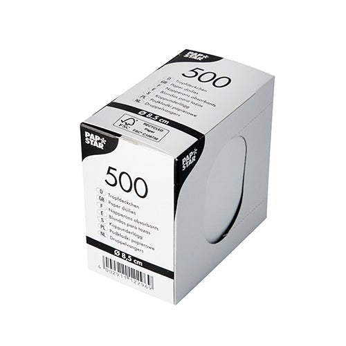 A white, rectangular PAPSTAR-A box containing 500 round drip-catchers (Ø 8.5 cm) for beverage napkins features product information, a barcode, and a round cutout (~5 cm) that reveals the white napkins inside.