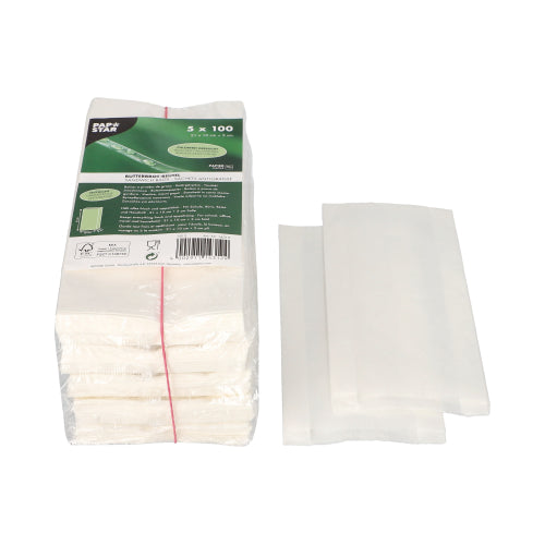 A stack of PAPSTAR greaseproof sandwich bags, 21x10x3 cm, white (500 pieces), lies next to three spread-out bags on a white background - ideal for keeping snacks and sandwiches fresh.