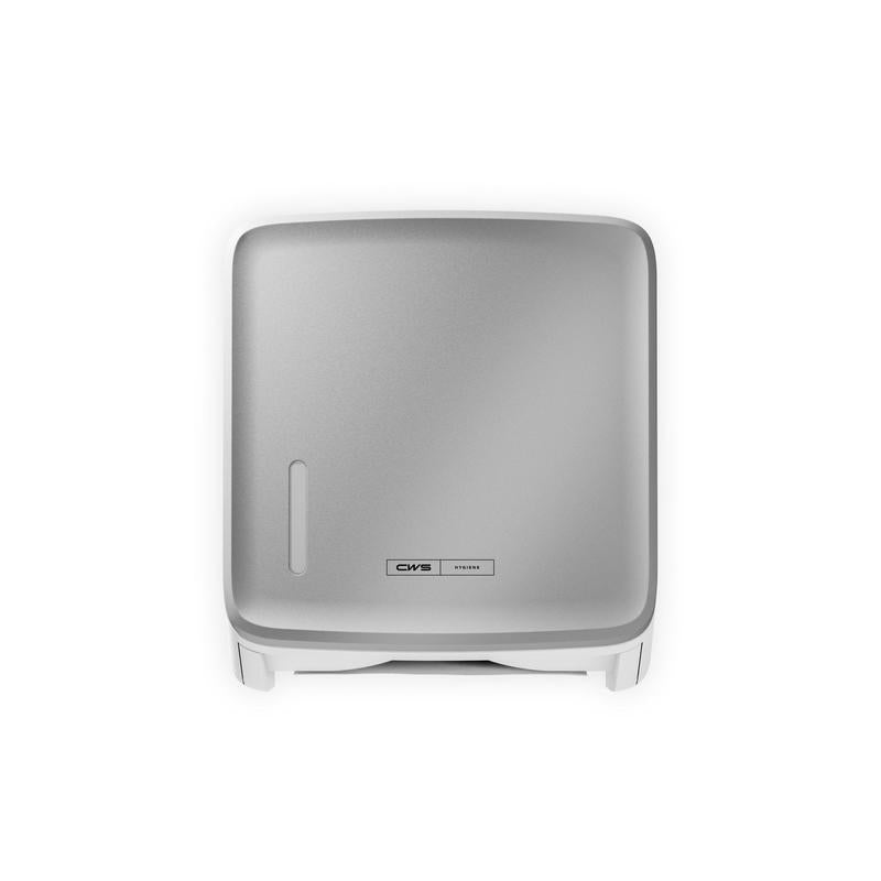 The CWS PureLine front panel for the paper dispenser is a silver wall panel with a small vertical window on the left side and a rectangular label in the lower center, set against a white background.