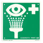 A green-white safety sign from Orkla Wound Care AB marks an "Emergency Sign - Eye Wash | Pack (1 piece)" station, showing an eye, a water jet, and a cross symbol, and guides to quick eye care with this essential emergency safety product.
