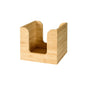 The Duni GmbH Bamboo Napkin Holder (11x11 cm) is a stylish, square bamboo table organizer with curved cutouts on the sides, ideal for holding napkins or coasters.