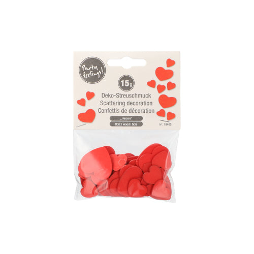 A transparent bag from PAPSTAR GmbH contains heart-shaped decorative scatter ornaments made of wood (15g) for decoration. The label reads "scatter decoration" and shows small heart illustrations on a white background.