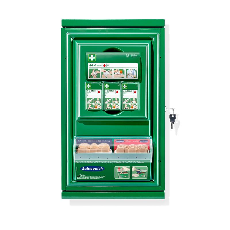 A green, wall-mounted Orkla Wound Care AB Cederroth First Aid Cabinet Mini (Metal), with instructions on the front, key lock, and transparent metal compartment containing various adhesive bandages. Size: W 260 x H 440 x D 170mm.