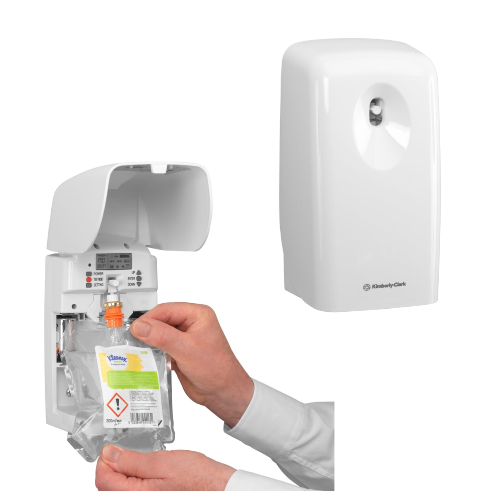 The user inserts a Kleenex® Scented Air Freshener Refill Pack 6190 by Kimberly-Clark GmbH into the wall-mounted dispenser. The dispenser is rectangular, white, and features a small top nozzle for dispensing fragrances.