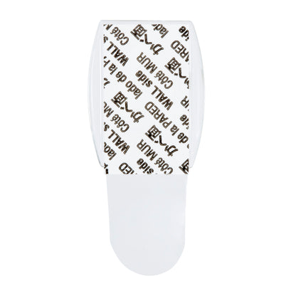 Ein 3M Command™ Mini-Haken, transparent (17006CLRFGN) von 3M Deutschland GmbH, ist von oben zu sehen - inkl. transparenter Strips mit "3M Command" und "WALL"-Aufdruck, ideal für Aufbewahrung ohne Bohren.