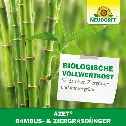 Close-up of green bamboo stalks and leaves with the Neudorff Shop logo. A label reads: "Azet Bamboo & Ornamental Grass Fertilizer - organic whole food and easy-care for bamboo, grasses, and evergreens."