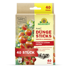 Der Neudorff Shop Azet Düngesticks für Tomaten & Erdbeeren ist ein 100% biologisches und natürliches Produkt mit 40 Sticks in einer rechteckigen Schachtel, die mit Tomaten- und Erdbeermotiven verziert ist.