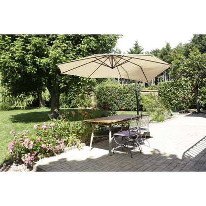 A wooden table with two metal chairs stands on a terrace under a beige umbrella, which was secured in the garden with 3M Scotch® Extremium™ Ultra High Performance Tape DT17 (25 m x 48 mm).