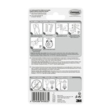 Auf der Rückseite des Command™ Edelstahl-Metallhakens Größe S, 17031SS-4ES (4 Haken, 5 Strips) der 3M Deutschland GmbH befinden sich eine mehrsprachige Anleitung mit Diagrammen, Barcode, Sicherheitshinweisen, Tipps zur Wandorganisation und das 3M Logo.