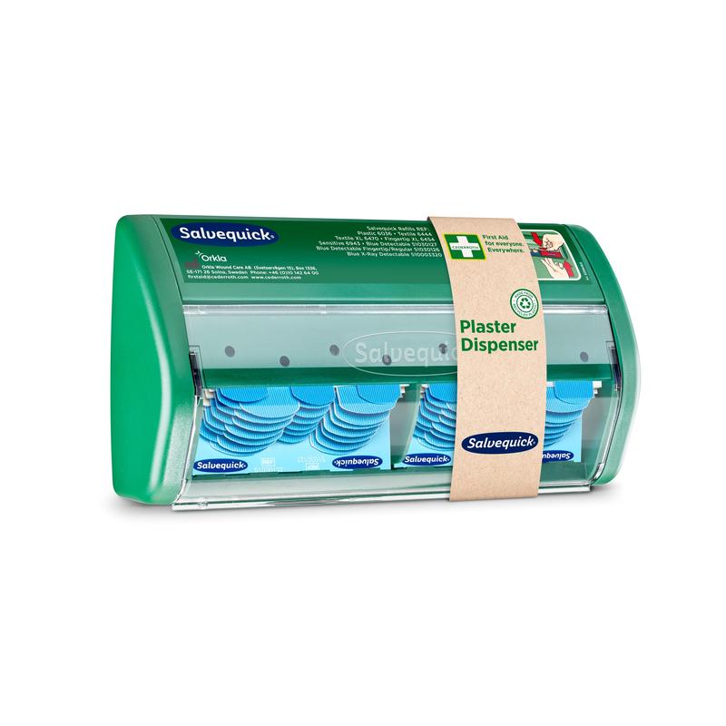 A Salvequick plaster dispenser from Orkla Wound Care AB has a transparent front and dispenses blue, detectable plasters; a brown paper band identifies it as a plaster dispenser".
