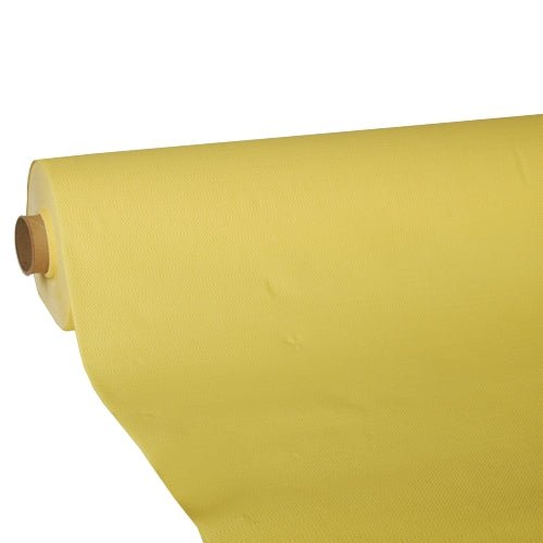 A large roll of light yellow PAPSTAR-Tablecloth, "ROYAL Collection" tissue from the PAPSTAR GmbH has been partially rolled out and showcases its smooth, slightly textured surface and high-quality tissue construction, which is wrapped around a sturdy cardboard core.