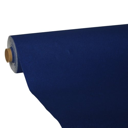 A large roll of dark blue PAPSTAR-Tablecloth, "ROYAL Collection" tissue from the PAPSTAR GmbH is partially unrolled, revealing its premium quality as it wraps itself around a cardboard tube against a plain white background.