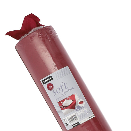 Eine teilweise ausgepackte Rolle roter Starpak-Tischdecke, stoffähnlich Vlies „Soft Selection“, mit einem Etikett mit Gebrauchsanweisungen und Bildern einer Tischdekoration.