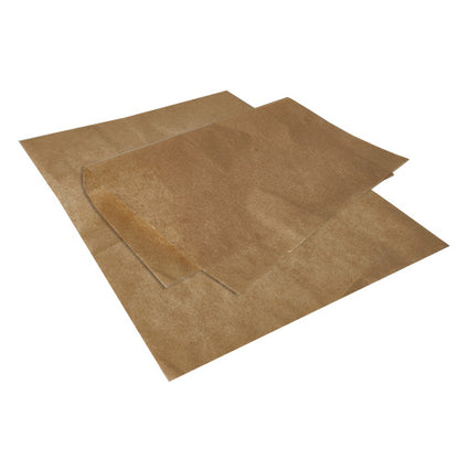 Two overlapping PAPSTAR wrapping papers, parchment substitute 35 cm x 25 cm greaseproof from PAPSTAR GmbH, lie on a white background. The wavy corner of a sheet emphasizes its thin, semi-transparent, greaseproof texture.