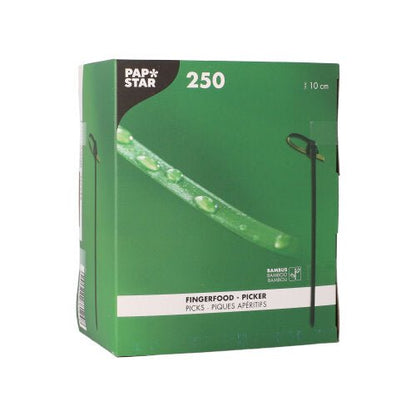 A green-and-white box containing the 250 finger food picks from the PAPSTAR The package contains 250 biodegradable bamboo sticks, each 10 cm long, with a green pick image printed on the front of each one.