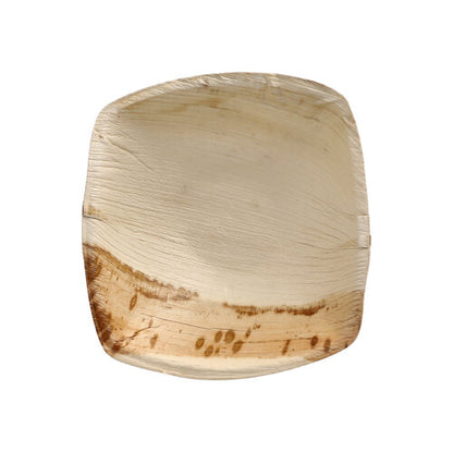 The PAPSTAR 25 palm leaf bowls "pure" "QUADRATO" natural from PAPSTAR GmbH is a square, light natural palm leaf plate with unique grain and a dark brown area, eco-friendly and biodegradable, shown empty on a white background.