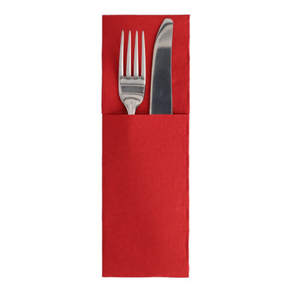 Silver fork and knife lie in a red napkin pocket folded in the classic cutlery fold style on a white background – an elegant addition to the ROYAL Collection "50 Napkins" (48 x 30 cm) with cutlery fold by PAPSTAR GmbH.