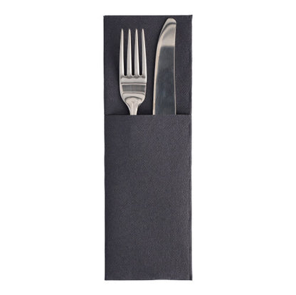 A silver fork and knife rest in a PAPSTAR GmbH napkin "ROYAL Collection" 48x30 cm with cutlery fold, with the handles visible above the black sleeve.