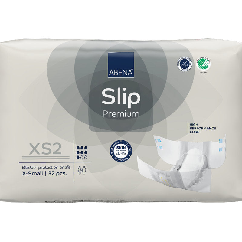 Eine 32er-Packung ABENA Slip Premium von Abena Re-Seller GmbH in der Größe XS2 X-Small in beiger Verpackung mit den Zertifizierungen "High Performance Core" und "Skin Friendly" für eine zuverlässige Inkontinenzversorgung.