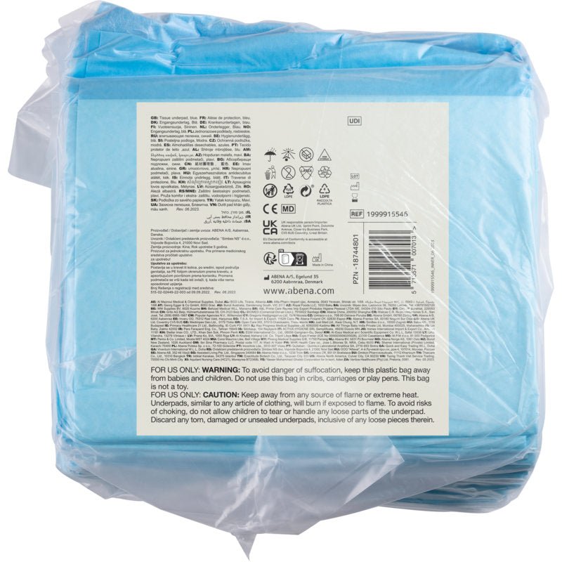 A transparent plastic package from Abena Re-Seller GmbH contains 25 blue, 6-ply ABENA Tissue disposable pads, 60x60 cm. The back label displays product information, symbols, a barcode, and multilingual warnings.