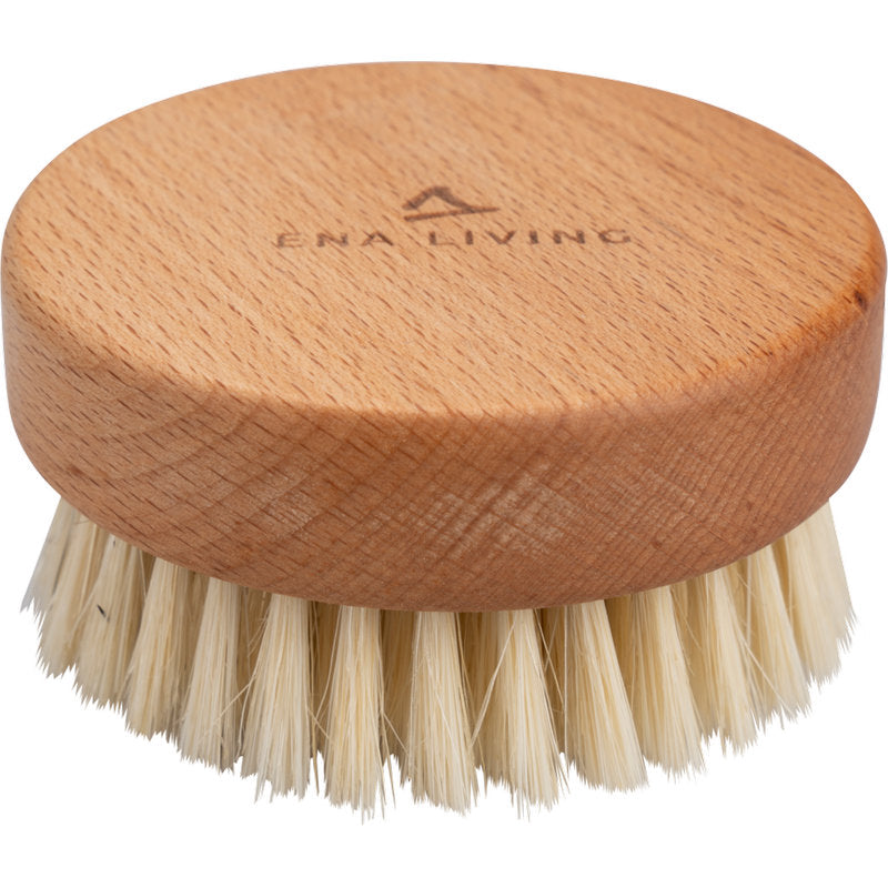 The ENA Living hand massage brush from Abena Re-Seller GmbH is a round wooden massage brush with natural bristles and the engraving "ENA LIVING" on the top. Sold in a box with 24 packs, it is ideal for relaxation and shown against a white background.