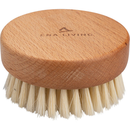 The ENA Living hand massage brush from Abena Re-Seller GmbH is a round wooden massage brush with natural bristles and the engraving "ENA LIVING" on the top. Sold in a box with 24 packs, it is ideal for relaxation and shown against a white background.