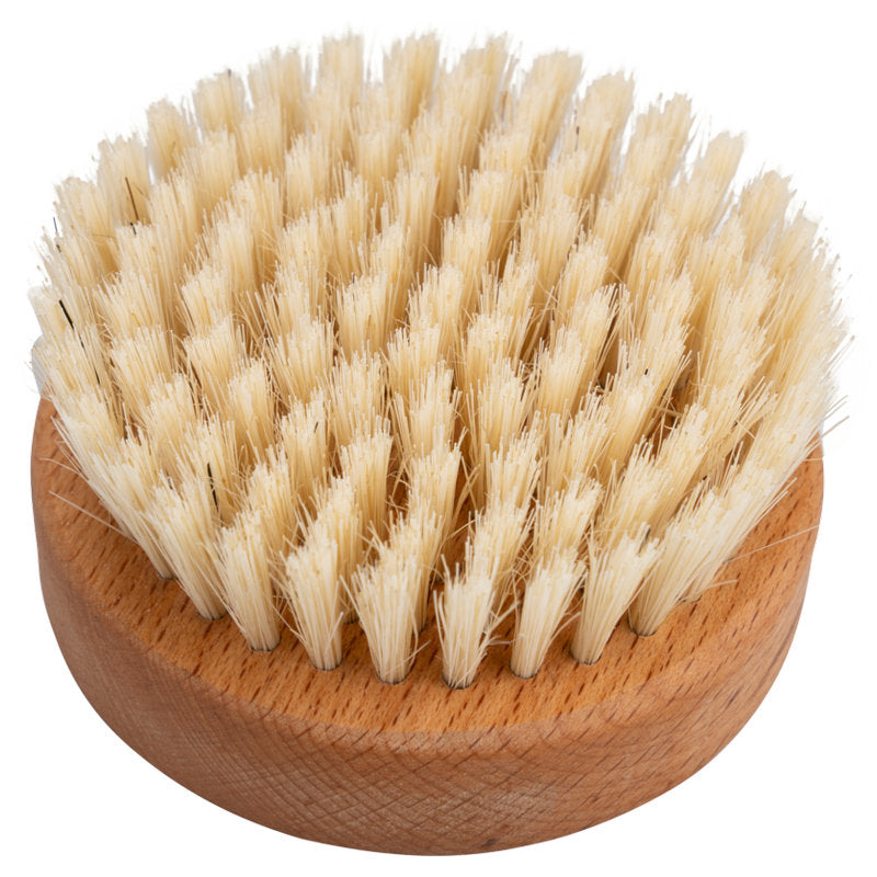 The ENA Living hand massage brush from Abena Re-Seller GmbH is a handleless round brush made of wood with densely packed light beige natural bristles to promote circulation and relaxation. Available as a box (24 packs).