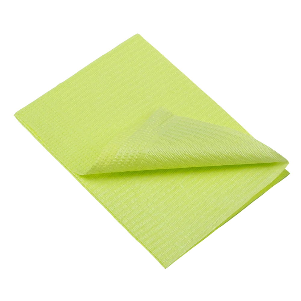 A folded, bright yellow AMPri Dental disposable patient napkin with a textured surface lies on a perfectly white background.