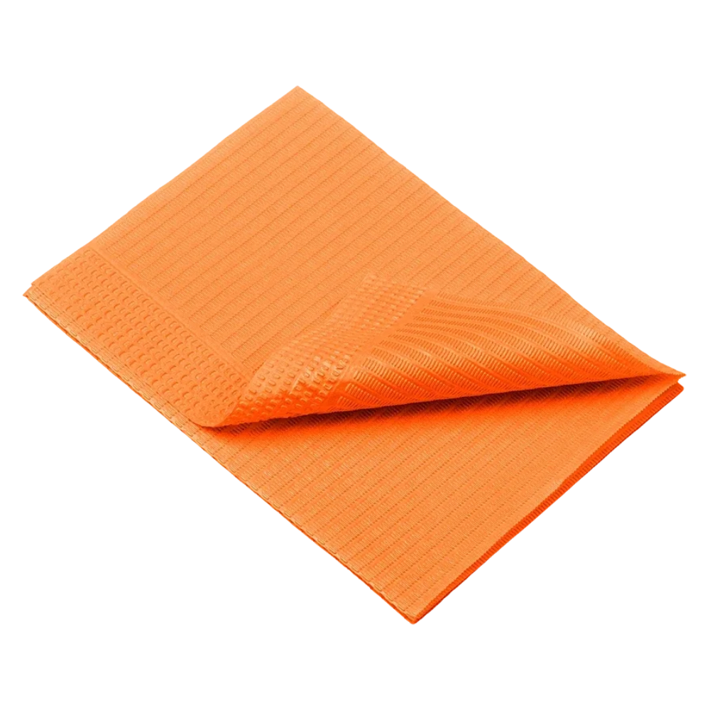 An orange towel, similar to the AMPri Dental disposable patient napkins from AMPri Handelsgesellschaft mbH, is neatly folded against a white background. Its texture is distinctly visible with vertical and horizontal grooves. One corner is slightly raised, showing the woven pattern on both sides.