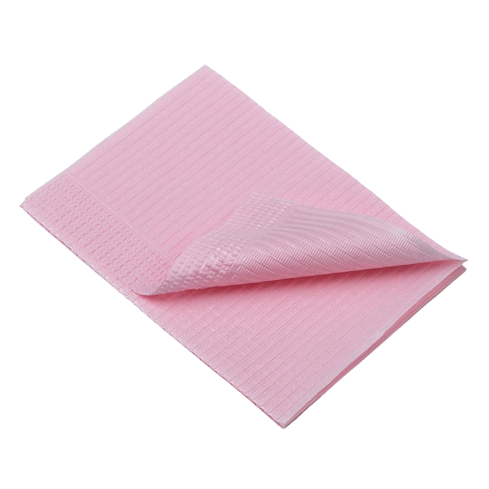 A folded, light pink AMPri Dental disposable patient napkin with a textured surface is seen against a white background. This soft and absorbent material resembles the dental napkins from AMPri Handelsgesellschaft mbH and is perfect for cleaning or wiping during dental treatment.