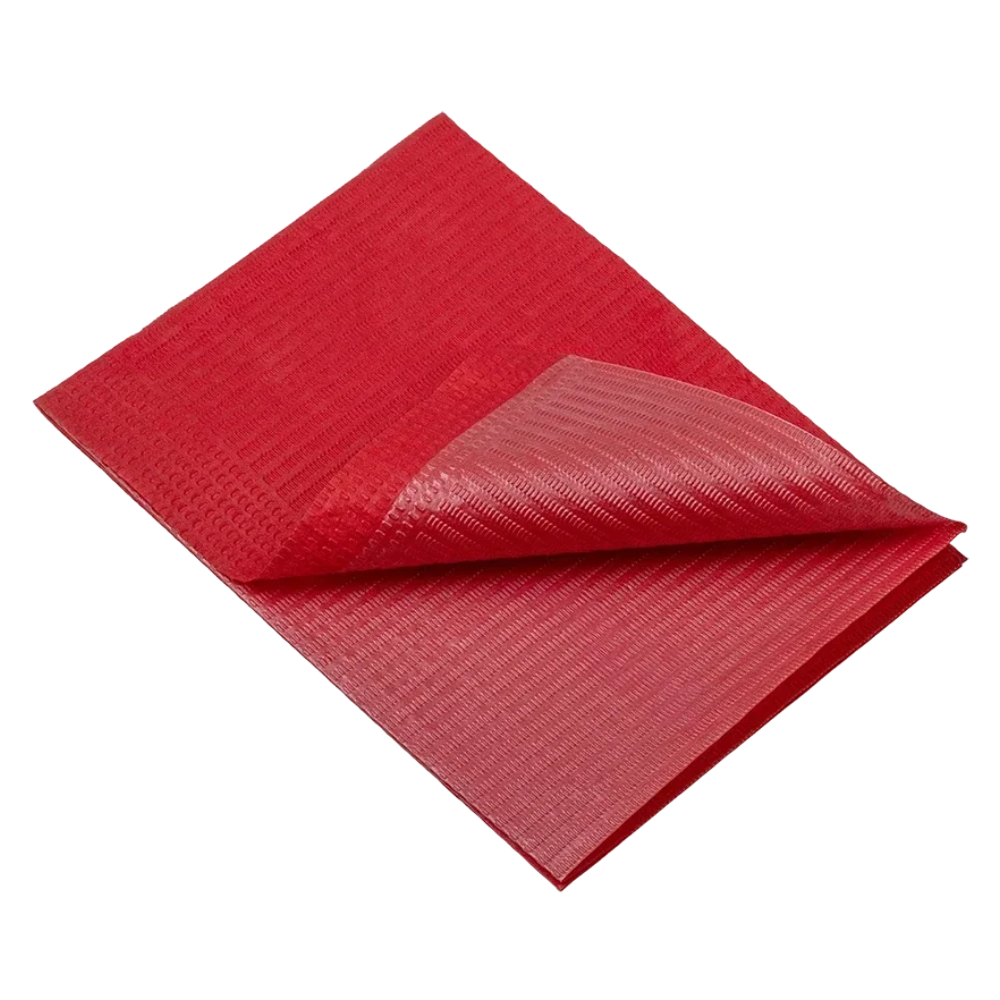 A folded red sheet of textured fabric mimicking the typical layer design of AMPri Dental disposable patient napkins 33 x 45 cm, available in various colors and packed in a box with 4 packs.