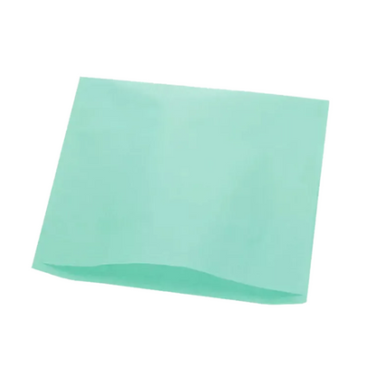 A flat sheet of polyethylene fabric in a gentle light blue-green lies in front of a white background. This unfolded AMPri Dental headrest cover suggests that it rests on a soft surface often associated with materials used in dental chairs.
