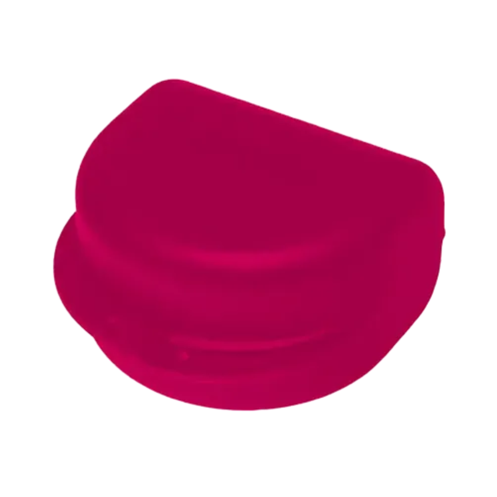 In front of a white background, a red, semi-circular object with a smooth surface and flat bottom is visible, resembling a small container lid or cap, likely made from polypropylene for orthodontic purposes. This item is part of the AMPri PP Dental brace box for adults by AMPri Handelsgesellschaft mbH.