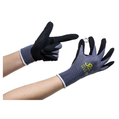 Two hands wearing AMPri SolidSafety Tough Air ultra-light assembly gloves from AMPri Handelsgesellschaft mbH are displayed on a white background. One hand is pointing with a finger while the other holds a small metal ring. These dark textured safety gloves are adorned with text and symbols and feature an abrasion resistance level of 4 for superior durability.