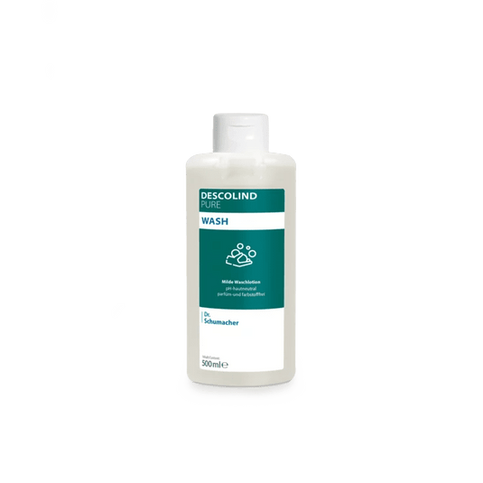 Eine weiße Kunststoffflasche der Dr. Schumacher Descolind Pure Wash Waschlotion (500 ml) von Dr. Schumacher GmbH, mit einem grün-weißen Etikett, steht vor einem schlichten hellgrauen Hintergrund. Diese pH-hautneutrale parfümfreie Waschlotion ist ideal für sensible Haut.
