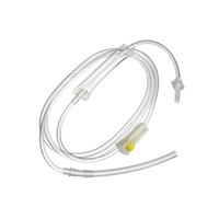 A transparent medical tubing set that B. Braun Ecospike® No. 1 by B. Braun Deutschland GmbH & Co. KG is shown rolled up against a white background, with connections, terminals, and a yellow filter for fluid administration or medical use visible.
