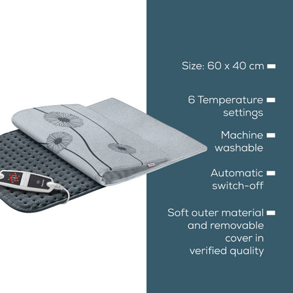 Image of a grey heating pad on a blue background. The Beurer HK 125 XXL Heating Pad Cosy Grey by Beurer GmbH features a floral design and an integrated controller. Important features include dimensions of 60 x 40 cm, 6 heat settings, machine washability, auto shut-off, soft outer material with a removable cover, and certification according to OEKO-TEX® STANDARD 100.