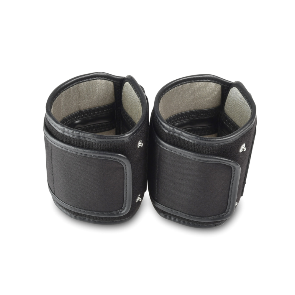 A pair of black wrist cuffs with Velcro fasteners, reminiscent of cuffs and designed for use with a Beurer cuff for the EMS muscle stimulator device EM 95. The inside is padded for more comfort. The cuffs are depicted standing upright and side by side on a plain white background.