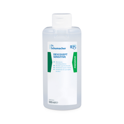 A 500 ml bottle of Dr. Schumacher Descosept Sensitive Rapid Disinfection from Dr. Schumacher GmbH, developed for the disinfection of medical products. The transparent bottle features a white label with the product name and usage instructions in several languages, including English, German, and French, as well as a green 'Preserve' label on the side.