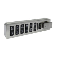 The Novocal electronic combination lock features a horizontal keypad with black number keys, letters, a power button, and a rotating metal knob on the right side, all mounted on a brushed metal plate.