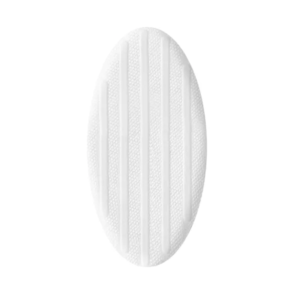 Eine weiße, ovale Gummimatte mit erhabenen, strukturierten Linien für Rutschfestigkeit, geeignet für die Nasstherapie von Wunden, isoliert auf weißem Hintergrund. Sie ähnelt der Hartmann HydroClean® Wundauflage der Paul Hartmann AG.