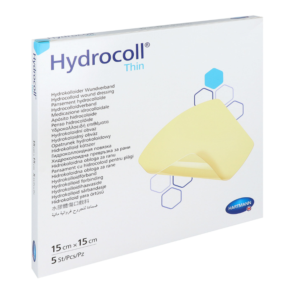Eine Schachtel Hartmann Hydrocoll® thin Verband Hydrokolloid-Wundverband von Paul Hartmann AG. Die Verpackung ist weiß mit blauen und gelben Designelementen und Text in mehreren Sprachen. Sie misst