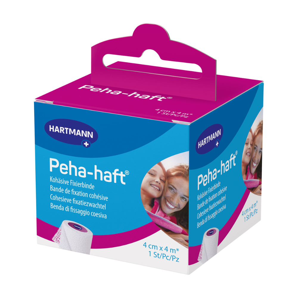 Eine verpackte Hartmann Peha-haft® latexfrei Fixierbinde-Box der Paul Hartmann AG mit Bildern des Produkts und einer lächelnden Frau an den Seiten und der Größenangabe 4 cm x 4 m.