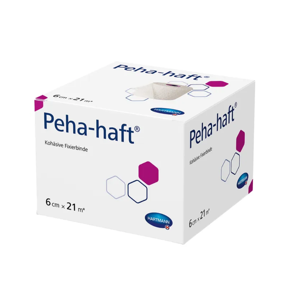 Eine Schachtel Hartmann Peha-haft® latexfrei Fixierbinde von Paul Hartmann AG, 6 cm x 21 m groß. Die Verpackung ist weiß mit violetten und rosa Akzenten und zeigt Produktinformationen.
