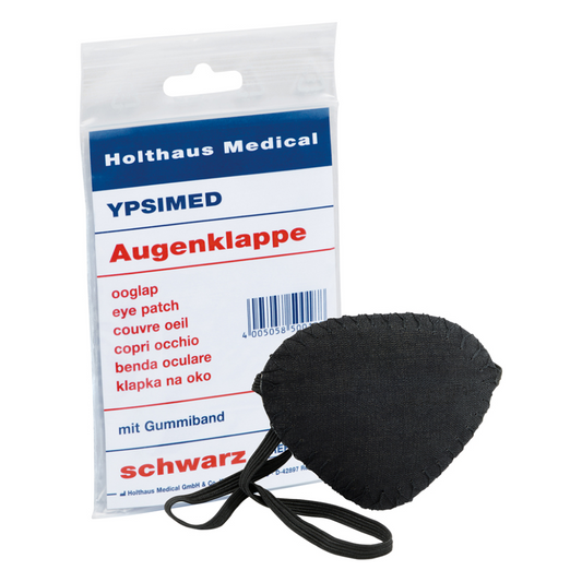 Eine verpackte Augenklappe von Holthaus Medical mit der mehrsprachigen Aufschrift „Holthaus Ypsimed Augenklappe, mit Gummiband“, bestehend aus einer schwarzen Augenklappe mit einem elastischen Band auf weißem Hintergrund.