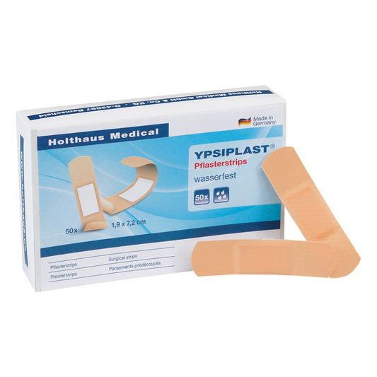 Eine Schachtel Ypsiplast® Pflasterstrips, wasserabweisend, von Holthaus Medical mit 50 Pflastern, präsentiert mit zwei Heftpflastern auf der Vorderseite, um das Produktdesign und die Verpackung zu präsentieren.
